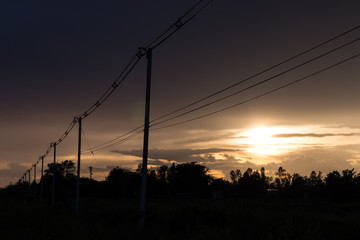 Power poles in the evening in the countryside.