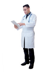 Doctor holding a tablet computer while using it isolated on white background