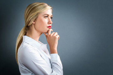 Young woman in a thoughtful pose