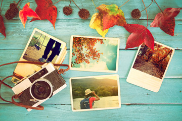 Fototapeta na wymiar Photo album in remembrance and nostalgia in autumn (fall season) on wood table. instant photo of retro camera - vintage and retro style