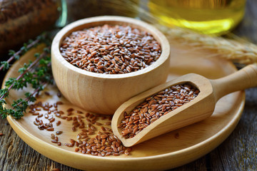 Flax seeds in bowl on table