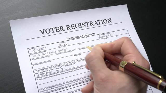 Voter registration form being filled.