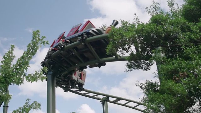 SLOW MOTION: People riding the roller coaster 4k