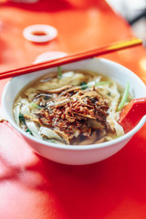 Ban Mian is a popular noodle dish, consisting of handmade noodles with flat egg served in soup or dried with vegetables, anchovy and fish or meat in Kuala Lumnpur, Malaysia. 