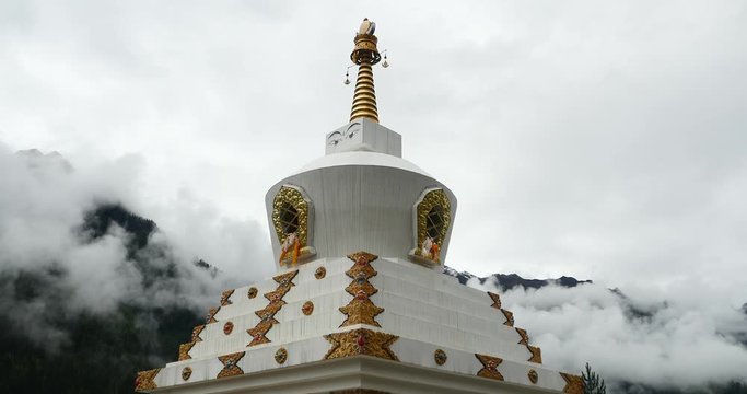 4k tibet buddhist white stupa,cloud cover mountain.