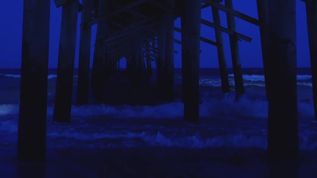 Ocean Waves Under a Dark Pier, Night Sky
