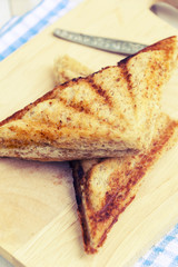 Sandwich with tuna spread and coffee on white wooden table. Selective focus and copy space,Vintage style.