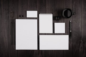 Blank corporate stationery on black stylish wood background. Branding mock up for branding, graphic designers presentations and business portfolios.