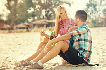 Happy couple having fun on the beach. Fun, summer, love concept.