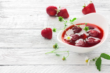 Strawberry jam and fresh strawberries