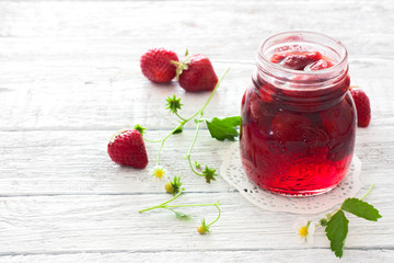 Strawberry jam and fresh strawberries