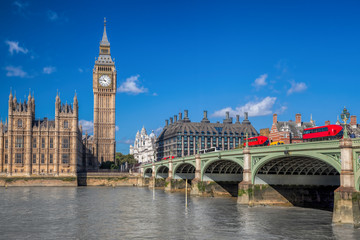 Fototapeta na wymiar London with red buses against Big Ben in England, UK