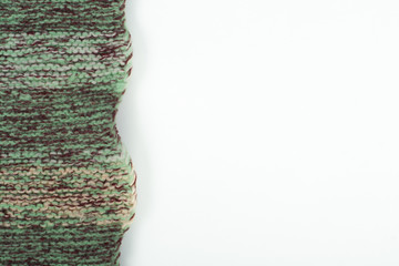 Fototapeta premium Sweater or scarf fabric texture large knitting. Knitted jersey background with a relief pattern. Wool hand- machine, handmade.