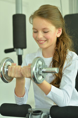 Little girl doing exercises 