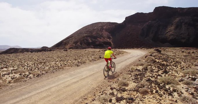 Mountain bike - man biking on MTB cycling trail. Man cycling enjoying healthy lifestyle and outdoor sports activity. RED EPIC SLOW MOTION.