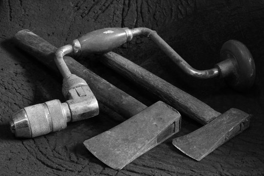 A set of traditional old vintage woodworking tools in black and white image	