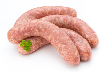 Raw sausage with parsley leaf isolated on white background.