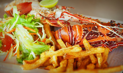 A dish with lobster and vegetables