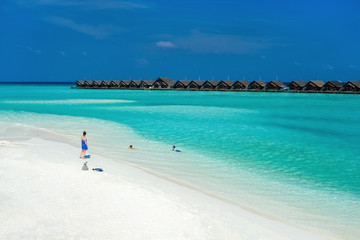 Mother and kids at tropical beach