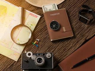 Accessories for travel, on wooden table.