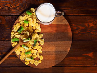 Still life with cornflakes on a wooden background
