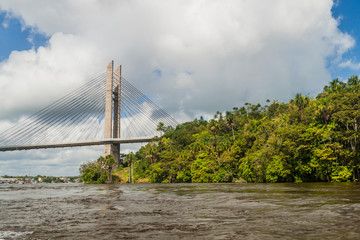 Fototapeta na wymiar Bridge over river Oyapock (Oiapoque) between French Guiana and Brazil