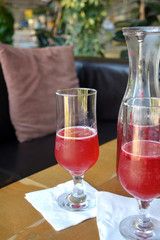 Summer lemonade with raspberry and leaves mint in a glass 