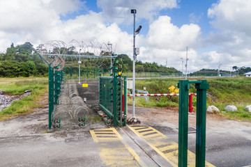 Fototapeta na wymiar Security fence at Centre Spatial Guyanais (Guiana Space Centre) in Kourou, French Guiana