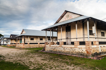 Fototapeta na wymiar Buildings of a prison Camp de la Transportation in St Laurent du Maroni, French Guiana