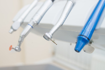 Closeup shoot of dental instruments in clinic, turbines, handpieces and drills.