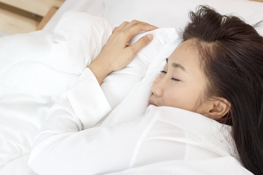 beautiful Asian women sleep on bed in bedroom