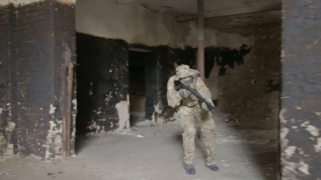 Guerilla partisan warriors operation in urban environment. War battlefield maneuvers training.