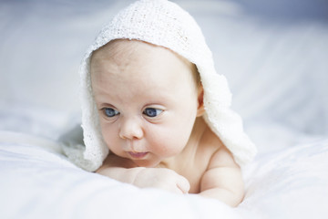 Beautiful baby girl on white blanket
