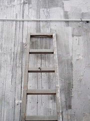 Old wood ladder on a wall