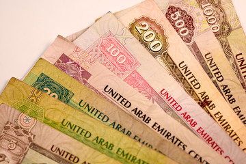 Close up Dirhams currency note and coins, AED, United Arab Emirates