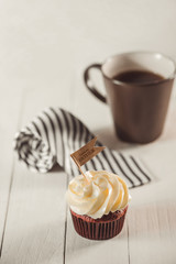 Fathers day concept. Delicious creative cupcake, tie on table.