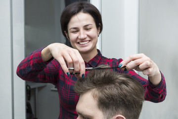 Fototapeta premium The young man at the hairdresser salon hairstyle make model