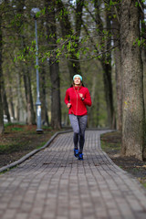 Bright girl running in the park, training