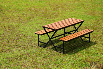 modern wooden bench on greensward