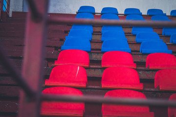 Tribune stadium with blue and red seats