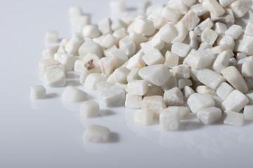 Fototapeta na wymiar beautiful natural white stone scattered on a white background