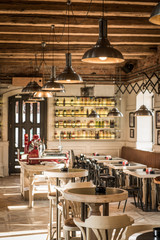 Coffee restaurant interior, row of ceiling lampos and seats