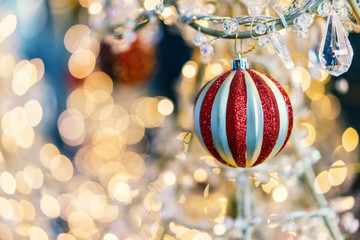 Red ball decorated on Christmas tree on Christmas Eve.