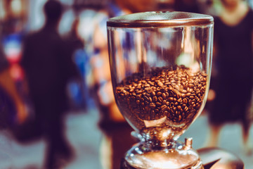 Coffee beans in a dozen coffee machines in old color scheme.