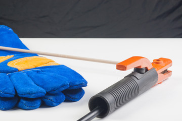 Welding gloves and holder