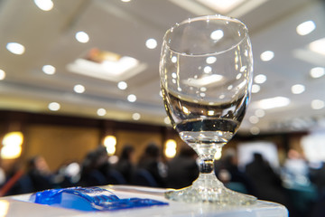 Wine glass placed on the table in the meeting room.