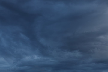 dramatic moody dark storm cloud sky used image for a bad day background