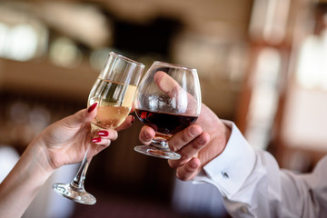hand making toast with glass