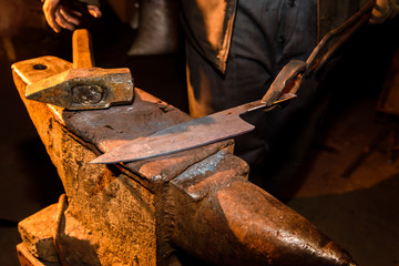Forge, anvil, knife making.