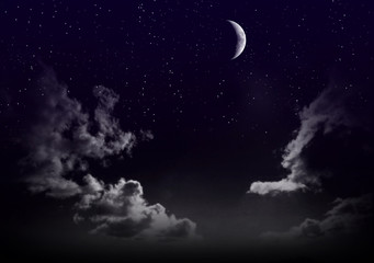Fototapeta na wymiar Beautiful magic blue sky with clouds and moon and stars at night closeup 